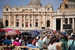 People queue in St. Peter's Square to pay their respect to the late Pope Francis, who will lie in state at St. Peter's Basilica for three days, at the Vatican on Wednesday.