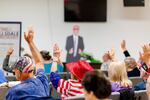 People gather for the America First Republicans meeting, a group of Republicans aligned with the Trump wing of the party on Oct. 3, 2024 in Hillsdale, Mich.