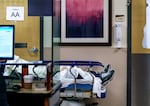 A patient waits for care in the hallway of the emergency department at Salem Health in Salem, Ore., in this Jan. 27, 2022 file photo. Beginning July 1, the state's Healthier Oregon program expanded to include anyone who qualifies, regardless of their immigration status.
