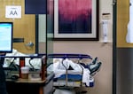 A patient waits for care in the hallway of the emergency department at Salem Health in Salem, Ore., last January. Oregon's three candidates for governor have different views on how to handle hospital staffing issues.