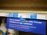A sign limiting baby formula purchases is seen on a shelf at a grocery store in Salt Lake City.