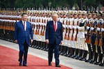 President Trump reviews an honor guard with Chinese President Xi Jinping during a welcome ceremony at the Great Hall of the People on May 14 in Beijing.