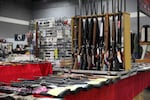 FILE: In this undated OPB photo, a variety of firearms are displayed for sale at a gun show in Oregon.