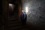 Joseph Bartosh stands in a patch of window light at St. Miklos Castle in Chynadiiovo, a town in western Ukraine. Since 2000, he's taken on the effort of restoring the medieval castle, whose earliest known mention is believed to be around 1450.