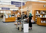 Khloe Warne, 12, uses a computer at the Josephine Community Library, Thursday, May 18, 2023, in Grants Pass, Ore. Khloe was put on shortened school days by her school district after incidents in which she fought with students and threw a desk in outbursts her mother, Alyssa, attributes to a failure to support her needs. Now she only attends school one day a week for two hours, and hasn't been on a regular school schedule for years, instead spending much of her time at her mother's bakery or at the local library.