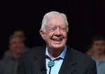 Former President Jimmy Carter speaks to the congregation at Maranatha Baptist Church before teaching Sunday school in his hometown of Plains, Ga., in April 2019. He taught Sunday school at the church on a regular basis after leaving the White House in 1981, drawing hundreds of visitors who would arrive hours early to get a seat.