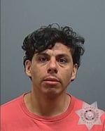 Undated mug shot of former Gresham police officer Hector Carranza, 37. Law enforcement has asked the public for help during their search for Carranza after he removed his monitoring bracelet last month while on house arrest.