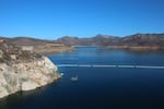 The San Vicente reservoir in San Diego County stores water from as far away as the Colorado River. Pumping water into a smaller reservoir in the surrounding mountains could store excess solar power until it's needed, when the sun sets.