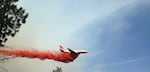 A heavy air tanker flies over the Milli Fire in the Three Sisters Wilderness in Central Oregon.
