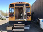 A school bus being converted into temporary housing.