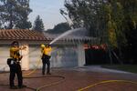 Firefighters work against the Mountain fire Wednesday, Nov. 6, 2024, near Camarillo, Calif.