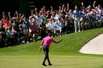 Tiger Woods pumps his fist after a birdie putt on the 16th green during the first round at the Masters golf tournament on Thursday, April 7, 2022, in Augusta, Ga.