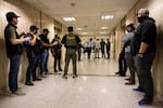 Federal agents wait outside an immigration courtroom at the Jacob K. Javits Federal Building in New York on June 10, 2025.
