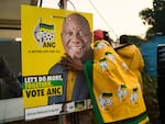 African National Congress (ANC) polling agents set up a tent decorated with party paraphernalia outside a polling station in Umlazi on May 29, during South Africa's general election.
