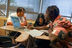 David Douglas High School seniors Tyrese, Ali, and Kofi talk about education funding in their Black Studies English class on Nov. 14, 2024.