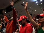 In this file photo from 2020, People raise their arms in prayer during a rally for evangelical supporters of President Donald Trump at the King Jesus International Ministry church, Friday, Jan. 3, 2020, in Miami.