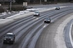 Cars head southbound on Highway 217 at Walker Road in Beaverton, Oregon, on Thursday, Dec. 15, 2016, following a snow storm.