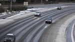 Cars head southbound on Highway 217 at Walker Road in Beaverton, Oregon, on Thursday, Dec. 15, 2016, following a snow storm.