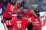 Canada's Connor McDavid (97) celebrates after his game-winning goal against the United States on Thursday during an overtime period of the 4 Nations Face-Off championship hockey game in Boston. 