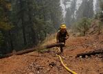 An Oregon Department of Forestry wildland firefighter working at the Smokey fire on August 5th, 2022
