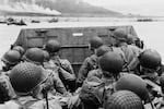 American soldiers huddle inside a landing craft approaching Utah Beach during the Allied invasion of Normandy, France, on D-Day.