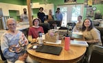 The founder and interns of Elderberry Wisdom Farm in Salem, Ore., July 9, 2026. Seated from left: Rose High Bear, Elderberry Wisdom Farm founding director; Roman Wood, intern; Paige Wentzel, intern; Jaimie Myrick Duckett, intern. Back, from left: David Mora-Flores, urban forestry coordinator; Joaquin Ocana, native plant nursery coordinator; Claudia Vega, intern; Damian Salazar, intern.