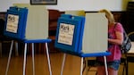 A voter casts a ballot in the Kansas primary on August 2, when Kansans voted resoundingly to keep abortion legal.