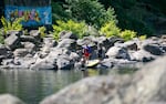 A crew of lifeguards complete their morning swim at High Rocks in Gladstone, Ore., July 15, 2025. Temperatures are expected to reach well over 90 degrees for the next few days, and Oregonians are attempting to stay cool in whatever ways they can. 