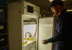 Oregon Agriculture department entomologist Joel Price checks on the growth of bugs in a lab growth chamber. November 2022