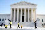 The exterior of the Supreme Court building on a clear day.