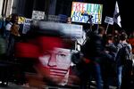 Supporters of WikiLeaks founder Julian Assange hold banners and placards as they protest in support of him, outside The Royal Courts of Justice, Britain's High Court, in central London on May 20, 2024.