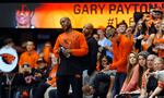 Oregon State alumni and Hall of Fame player Gary Payton, left, stands on the floor of the Ralph Miller court where he played as a college player, watching his son, Gary Payton Jr. Today, Payton is the new head basketball coach at Lincoln University in Oakland, where he grew up playing ball. (AP Photo/Greg Wahl-Stephens) 