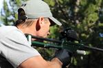 
Curtis Hendricks, Idaho Department of Fish and Game regional wildlife manager, aims a dart gun loaded with a tranquilizer at a 300-pound grizzly bear less than 20 yards away. 