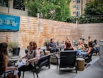A crowd starts gathering at the Victor Tavern in Eastlake for "Pitch-A-Friend," an event in which presenters give PowerPoint presentations on what makes their friend a great catch.
