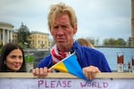 A white man with blond hair takes part in a rally in central Kyiv, Ukraine, Saturday, April 30, 2022. He is suspected of attempting to assassinate former President Donald Trump in 2024.