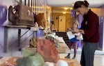 Attendees browse the 'art' to be auctioned at The Great Salt Lick contest & auction in Baker City on September 20, 2024.