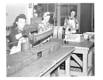 Women work on a line of grenades at the Umatilla Chemical Weapons Depot during World War II.