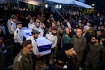 Soldiers carry a coffin during a funeral for Miryam Ayalon and her son, Barak Ayalon, in northern Israel on Jan. 15. They were killed in Hezbollah anti-tank missile attack in Kfar Yuval the day before.