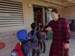 Diana Dickey greets students on their way into class.