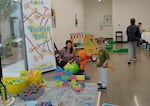Erica Segal, director of the Central Oregon Children’s Museum, watches as her son Lincoln Segal, 6, tries to knock down a foam tower at the museum’s pop-up event on Oct. 11, 2026 in Bend.