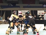London Rollergirls (black) compete against the Arch Rival Roller Derby at the 2016 International Championships of the Women's Flat-Track Derby Association in the Veterans Memorial Coliseum.
