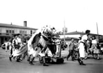 Vanport residents host a parade along Victory Boulevard in the middle of town.