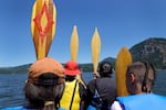 On the Warm Springs tribes' canoe ‘Nchi Wanapum, leaders shout "Paddles up!" as youth from various mid-Columbia River tribes pilot the vessel, near Cascade Locks, Ore., on July 19, 2023.