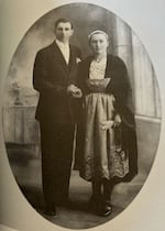 A picture of a photograph from a family album shows Eugene Tournellec and Marie-Louise Tournellec on their wedding day.