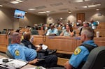 Law enforcement officers and poll managers in the coastal Georgia town of Brunswick discuss different threat scenarios during a class organized by the Committee for Safe and Secure Elections (CSSE) and the Georgia Secretary of State’s Office.