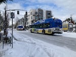 TriMet buses pause on any icy patch of of road at Northeast Alberta Street and 15th Avenue Northeast in Portland on Thursday, Feb. 23, 2023.