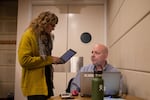 Bill Osborne speaks with a colleague during a court hearing Tuesday, Oct. 8, 2019, at the Multnomah County Justice Center in Portland, Ore. Osborne, who manages the county's diversion courts, said the mental health care system needs something to help people who need hospital-level care but don't meet admission standards.