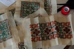 Embroideries on canvas are placed on a table at the sewing workshop at Beit Atfal Assumoud organization in the Palestinian refugee camp of Shatila, Beirut, Lebanon, on Dec. 2, 2024.