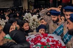 On Feb. 17, relatives mourn the seven members of the Berjawi family who were killed in their home by Israeli rockets, in the southern Lebanese city of Nabatieh.