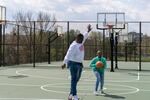 Joseph Yusuf plays basketball with his daughter, Jakayla Morton, 11, in Alexandria, Va., on March 29.